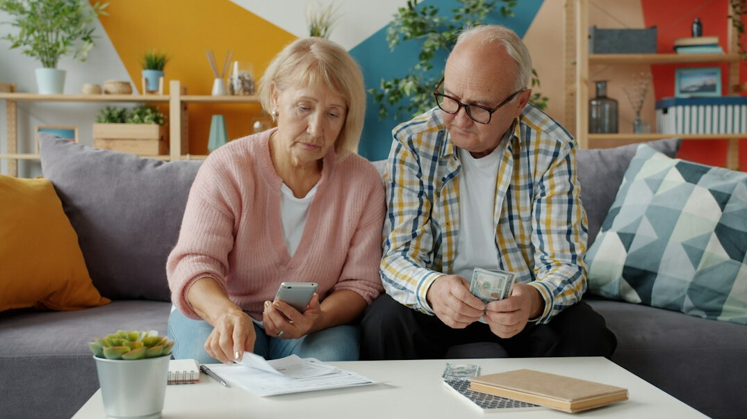 Colleagues reviewing documents together at a desk