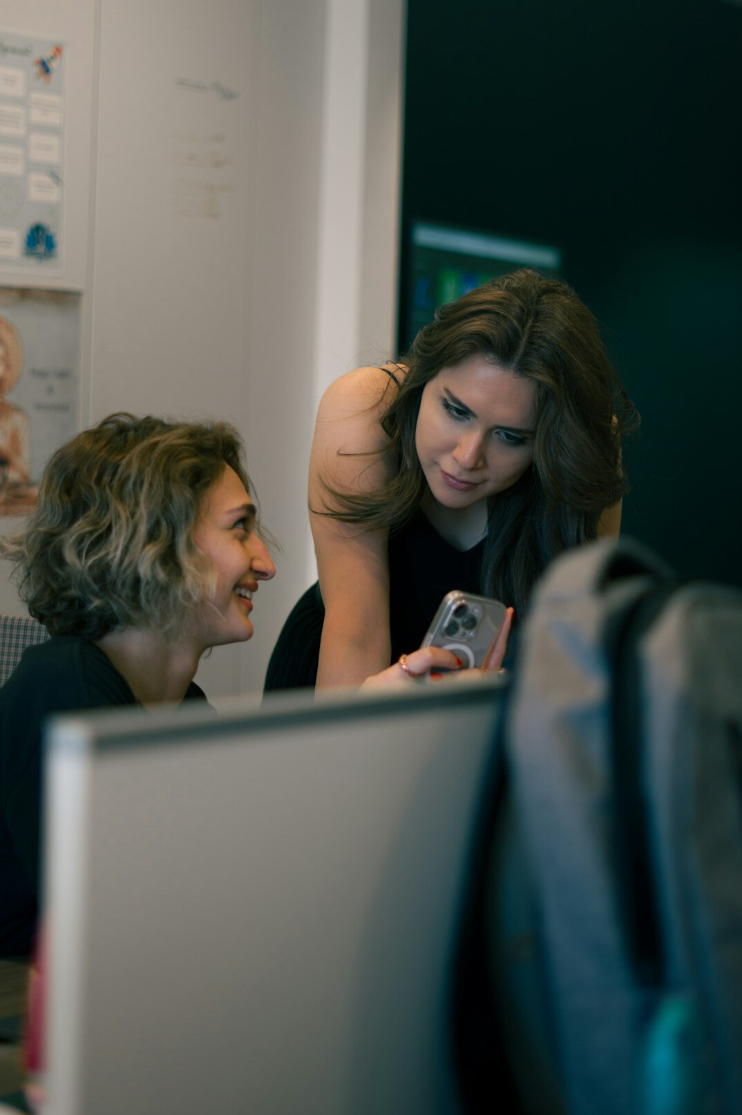 colleagues talking in office
